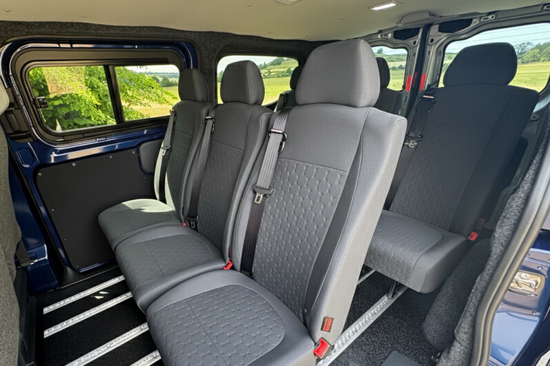 Rows of passenger seats in a Volkswagen Transporter